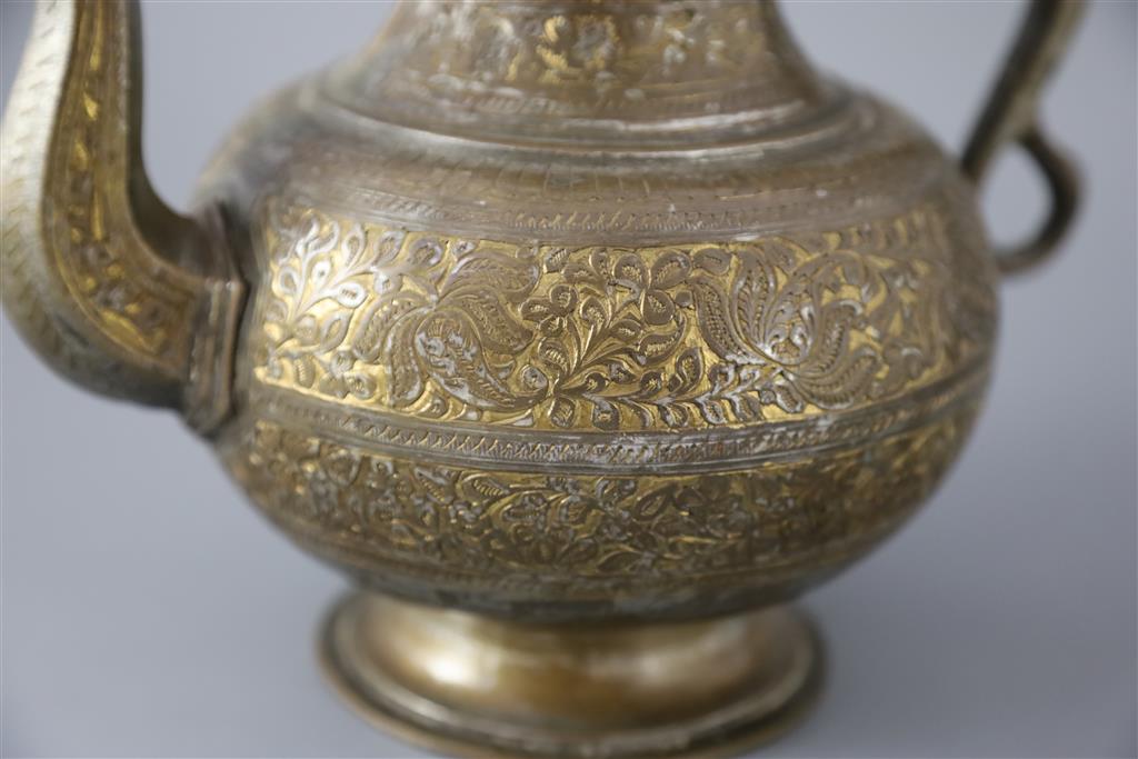 An 18th century Mughal Indian bronze and parcel gilt ewer, 26cm high